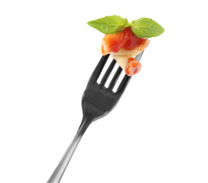 Photo of Delicious penne pasta with tomato sauce on fork against white background