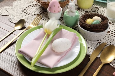 Photo of Festive table setting with beautiful tulip, closeup. Easter celebration