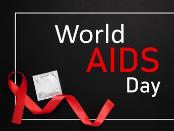 Image of World AIDS Day poster. Frame with red awareness ribbon. condom and text on black background