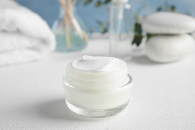 Photo of Jar of body care product on table