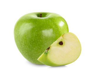 Cut and whole green apples on white background