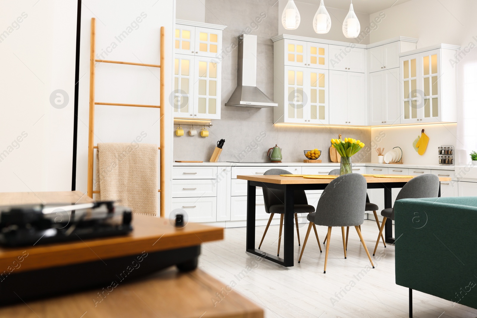 Photo of Spring atmosphere. Stylish kitchen interior with comfortable furniture