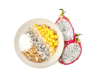 Bowl of granola with pitahaya, mango and yogurt on white background, top view