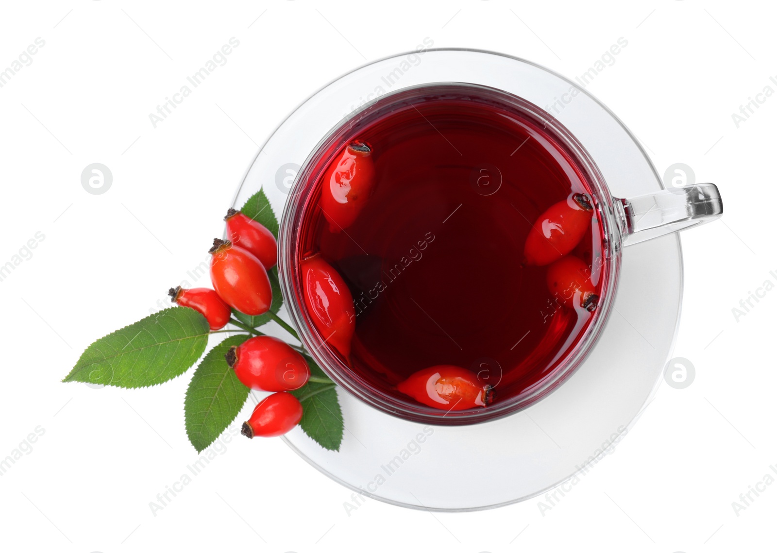 Photo of Aromatic rose hip tea and fresh berries on white background, top view