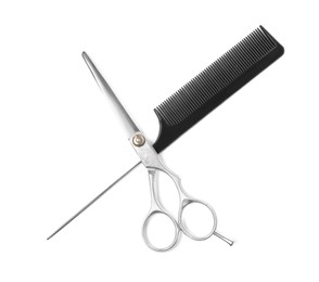 Photo of Professional hairdresser scissors and black comb isolated on white, top view. Haircut tools
