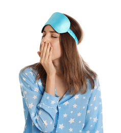 Photo of Beautiful woman wearing pajamas and sleep mask on white background. Bedtime