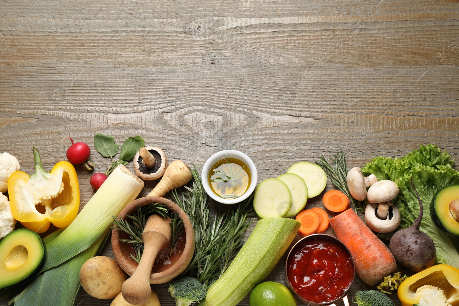 Photo of Flat lay composition with fresh products on wooden table, space for text. Healthy cooking