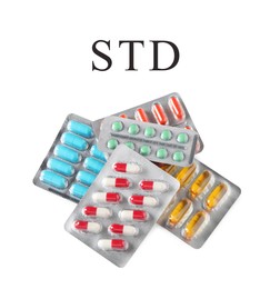 Image of Different pills and abbreviation STD on white background