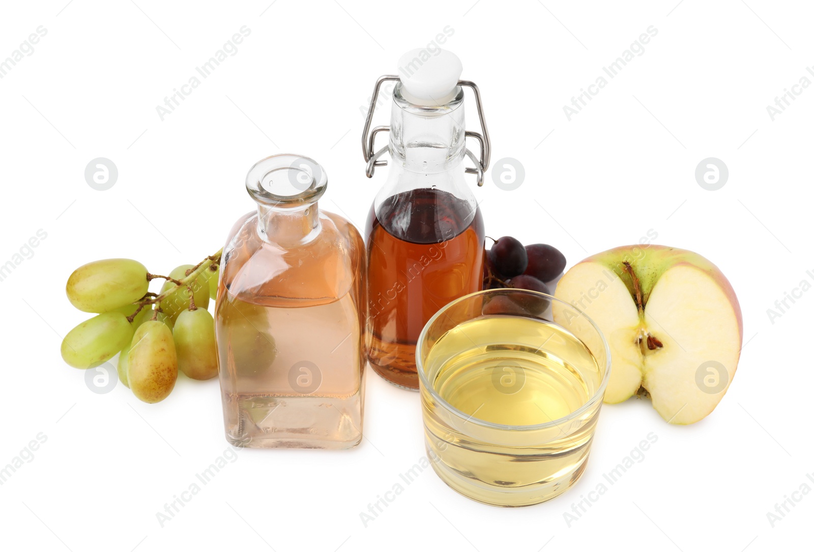 Photo of Different types of vinegar and ingredients isolated on white