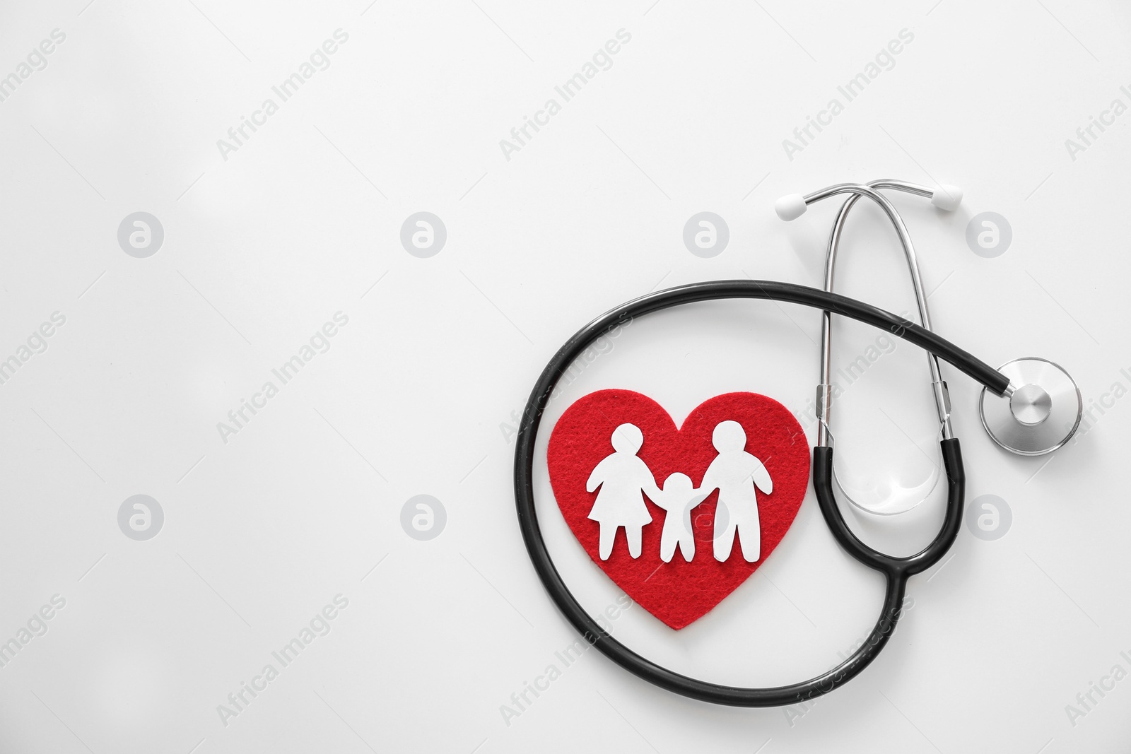 Photo of Paper silhouette of people, red heart and stethoscope on light background, top view