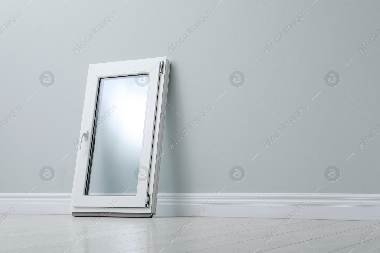 Photo of Modern single casement window near light grey wall indoors, space for text