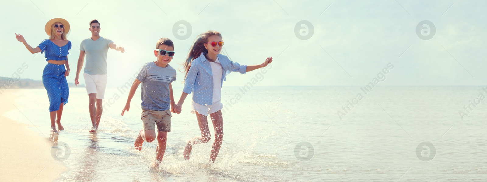 Image of Happy family at beach on sunny summer day, space for text. Banner design