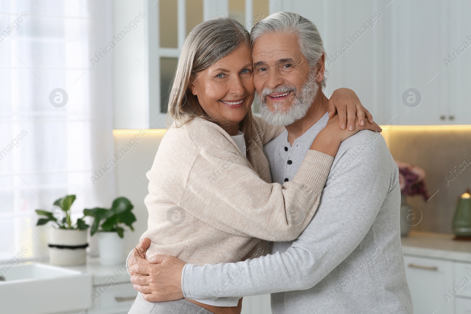 Photo of Senior couple spending time together in kitchen