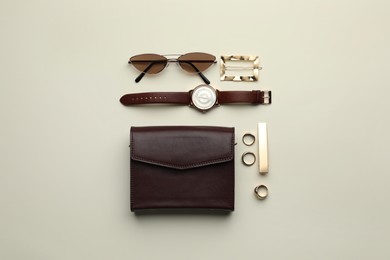 Photo of Stylish woman's bag and accessories on light background, flat lay