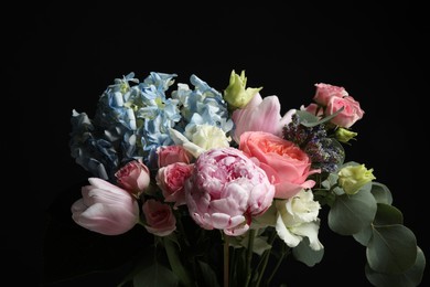 Beautiful bouquet of fresh flowers on dark background