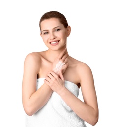 Photo of Young woman applying hand cream on white background