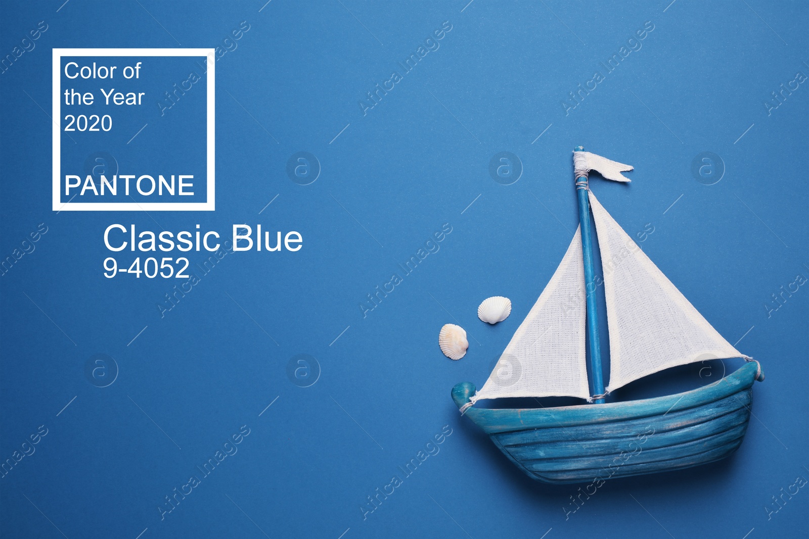 Image of Toy ship on bright background, top view. Color of the year 2020 (Classic blue)