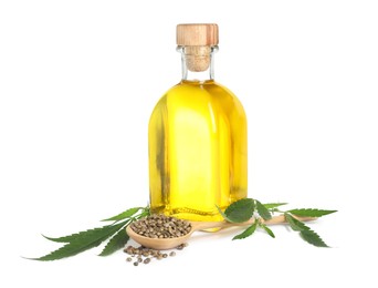 Photo of Hemp oil, fresh leaves and seeds on white background