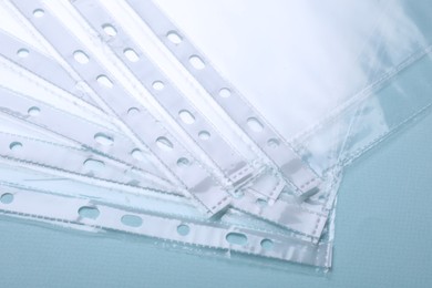 Empty punched pockets on turquoise background, above view