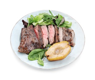 Photo of Pieces of delicious roasted beef meat, caramelized pear and greens isolated on white