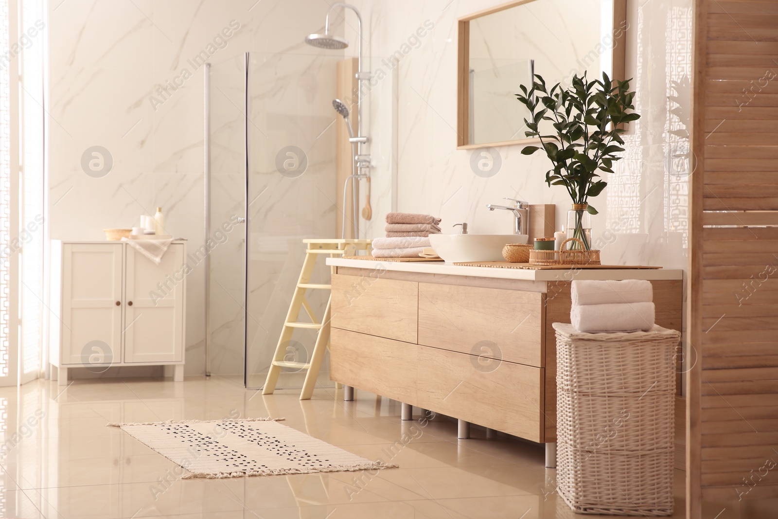 Photo of Modern bathroom interior with stylish mirror and vessel sink