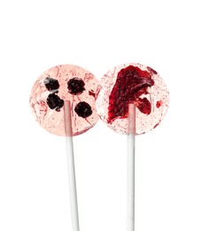 Photo of Sweet colorful lollipops with berries on white background