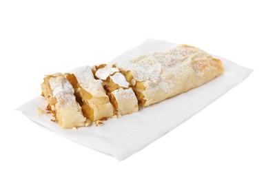 Photo of Delicious apple strudel with almonds and powdered sugar on white background