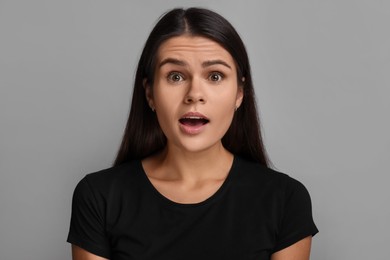 Personality concept. Emotional woman on grey background