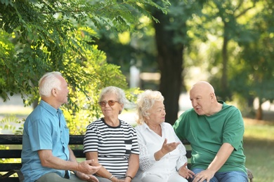 Photo of Elderly people spending time together in park