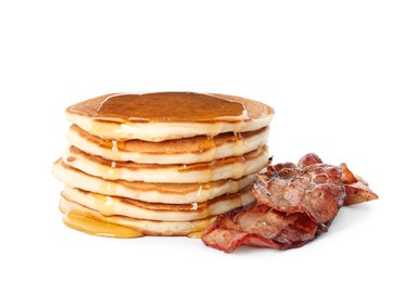 Delicious pancakes with maple syrup and fried bacon on white background