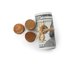 Photo of Roll of dollar bills tied with rope and coins isolated on white, top view