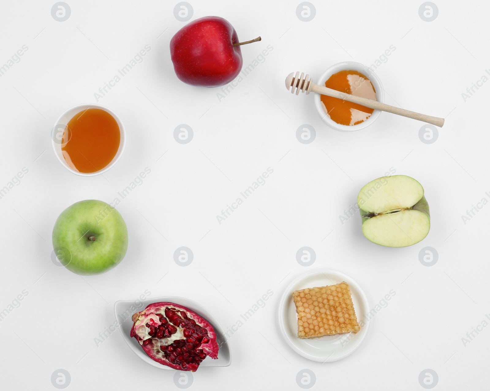 Photo of Honey, apples and pomegranate on white background, top view with space for text. Rosh Hashanah holiday