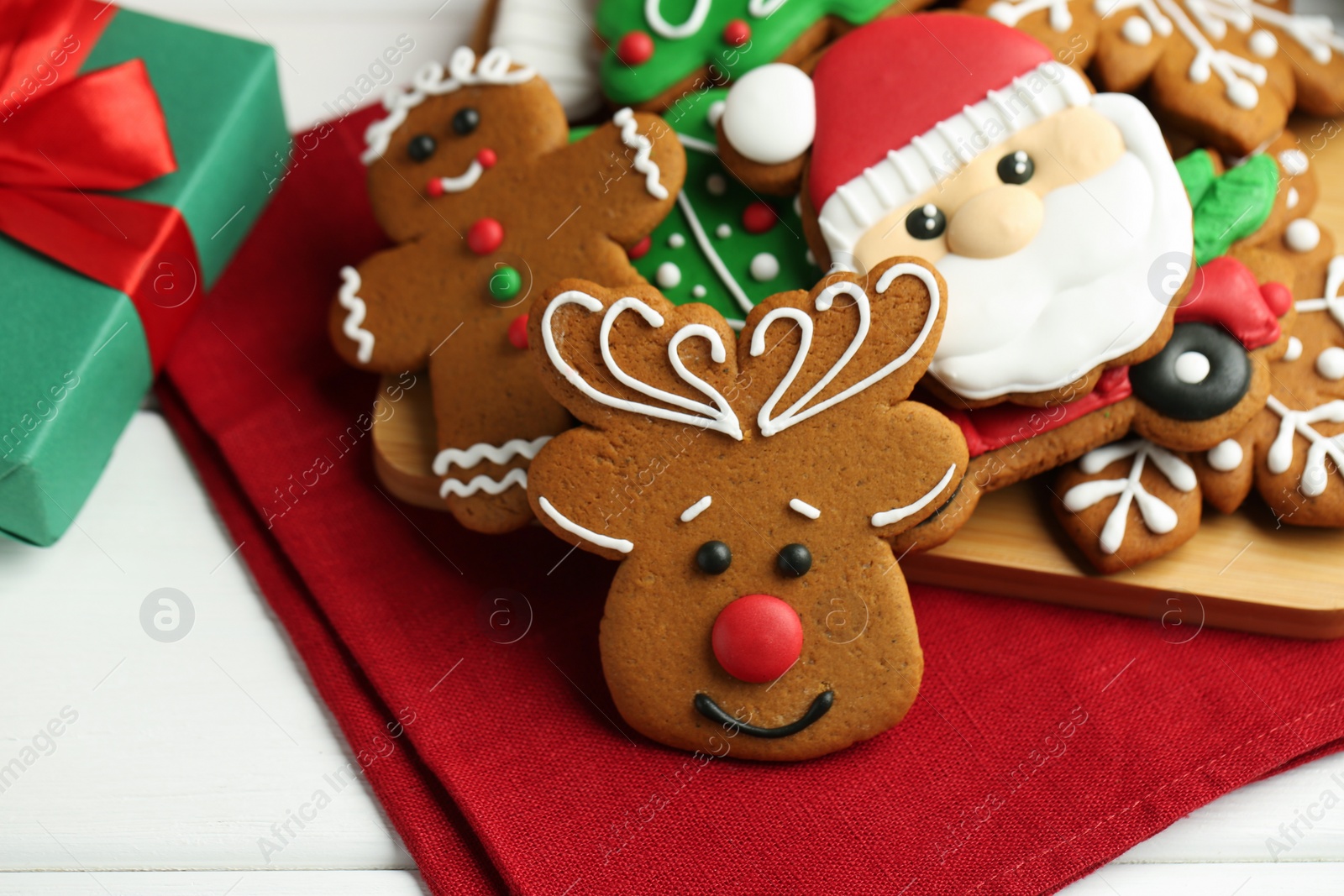 Photo of Tasty homemade Christmas cookies on white wooden table