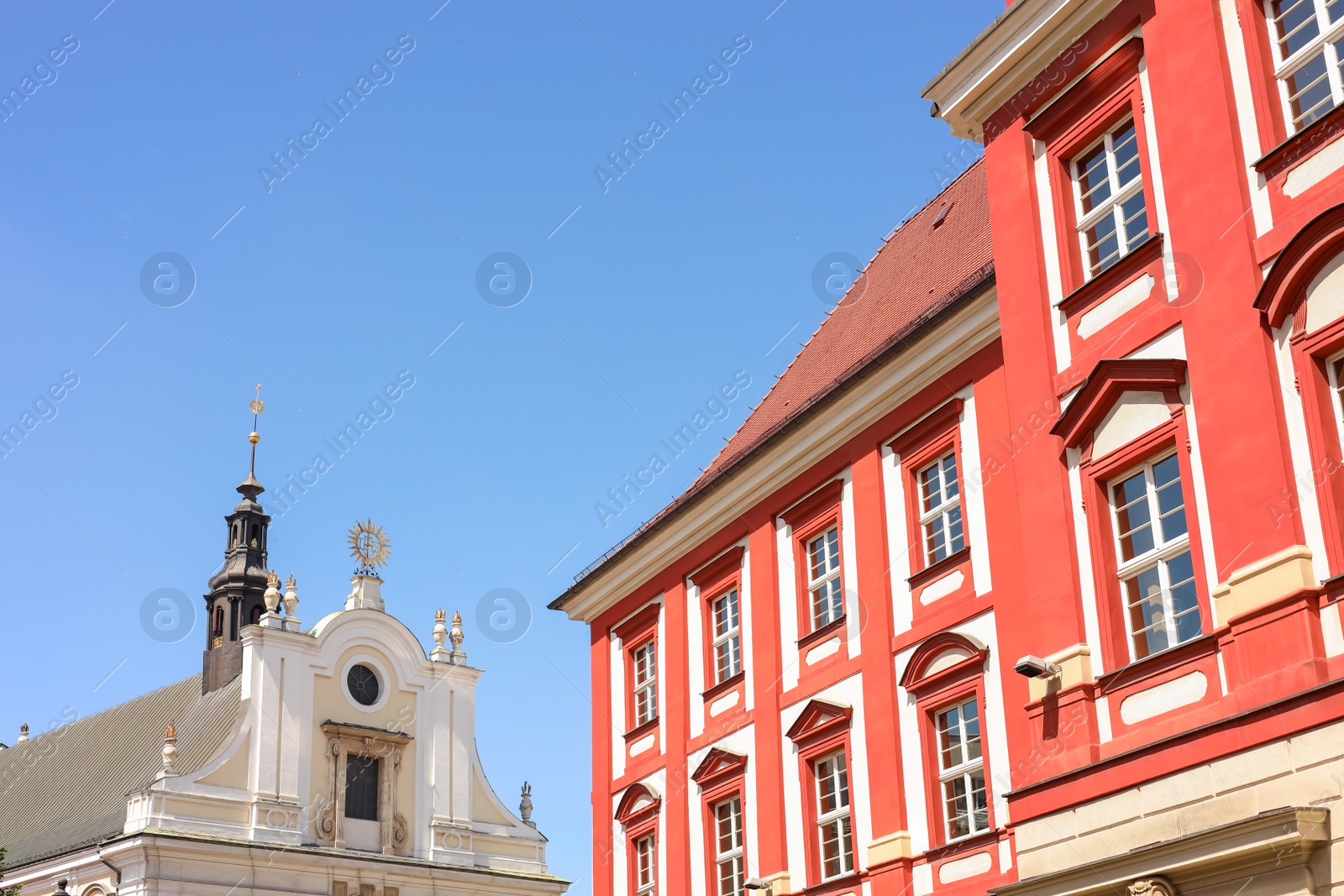 Photo of Beautiful old buildings against blue sky, low angle view