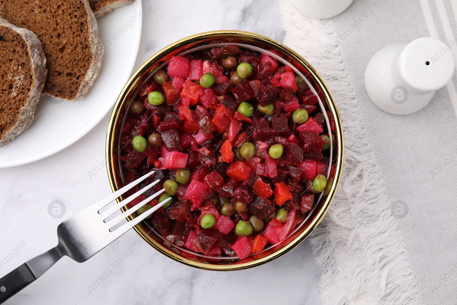 Photo of Delicious vinaigrette salad on white marble table, flat lay