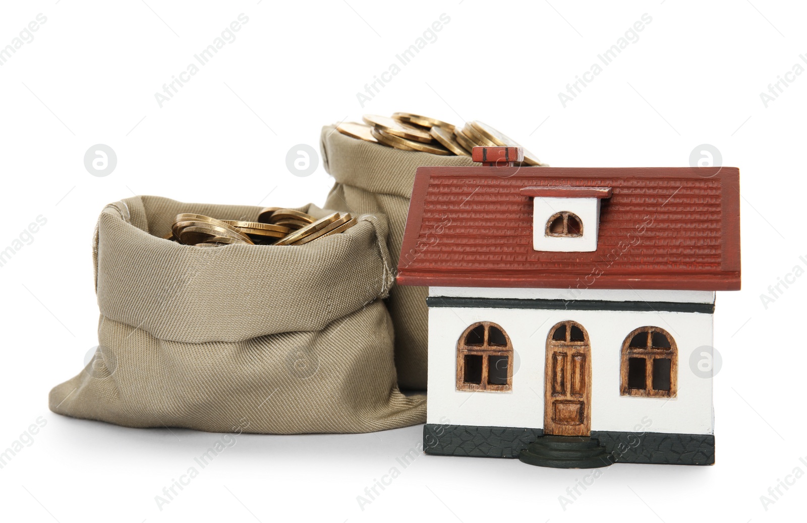 Photo of House model with money on white background