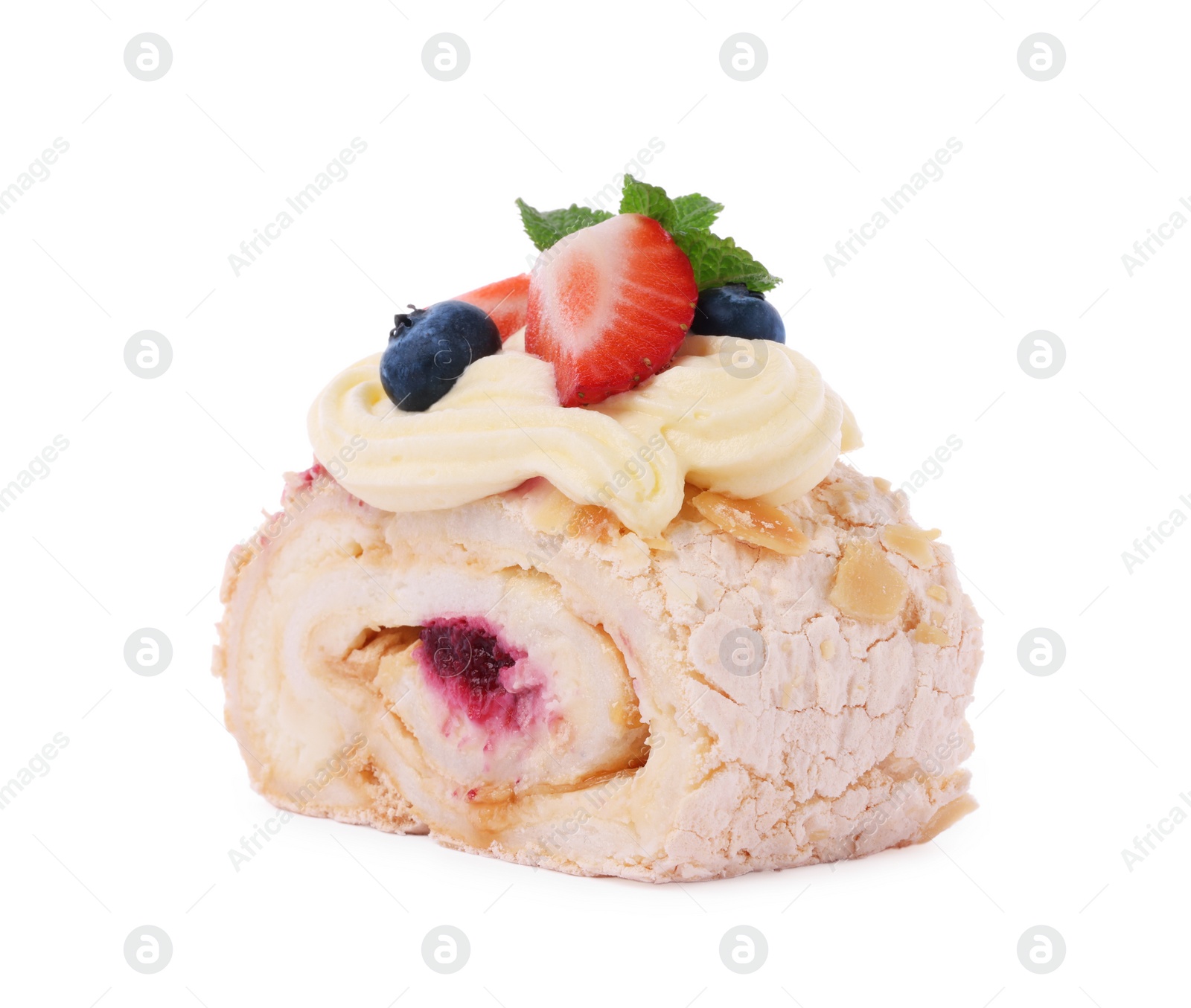 Photo of Slice of tasty meringue roll with jam, berries and mint leaves isolated on white