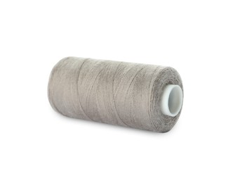 Photo of Spool of light grey sewing thread isolated on white