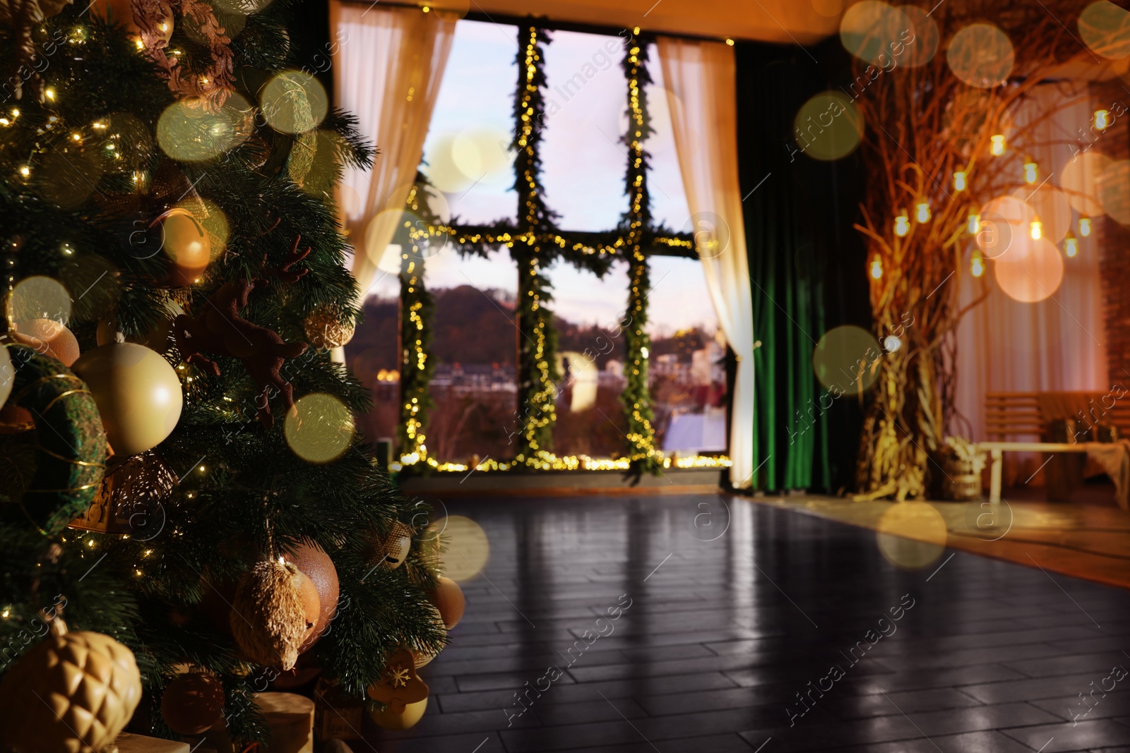Photo of Beautiful Christmas tree in room with festive decor