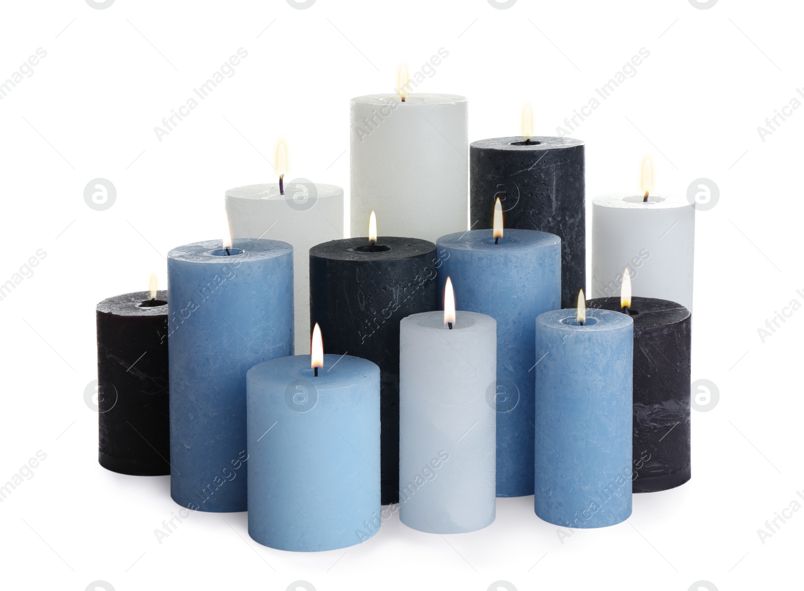 Photo of Set of different color candles on white background