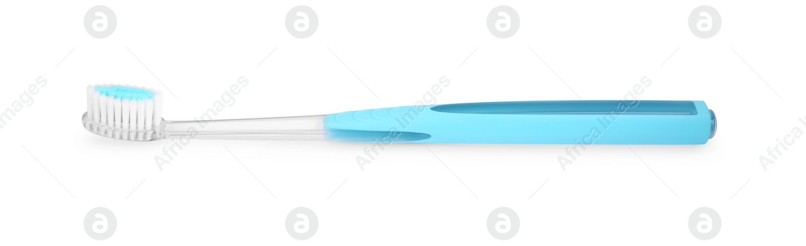 Photo of Light blue plastic toothbrush isolated on white