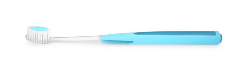 Light blue plastic toothbrush isolated on white