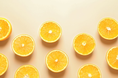 Flat lay composition with ripe oranges on color background