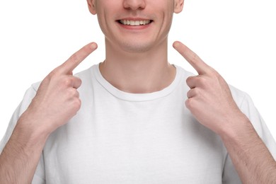 Photo of Man showing his clean teeth on white background, closeup