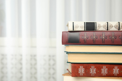 Collection of different books indoors. Space for text