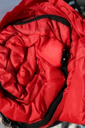 Photo of Rolled sleeping bag, closeup. Professional camping equipment