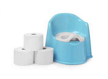 Photo of Light blue baby potty and toilet paper isolated on white