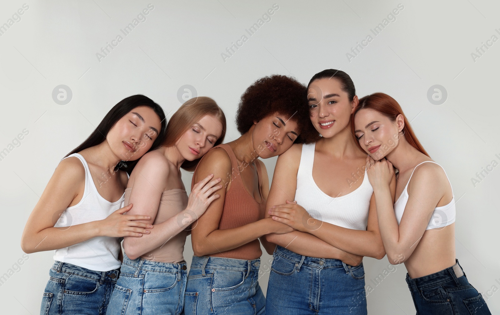 Photo of Portrait of beautiful young women on light grey background