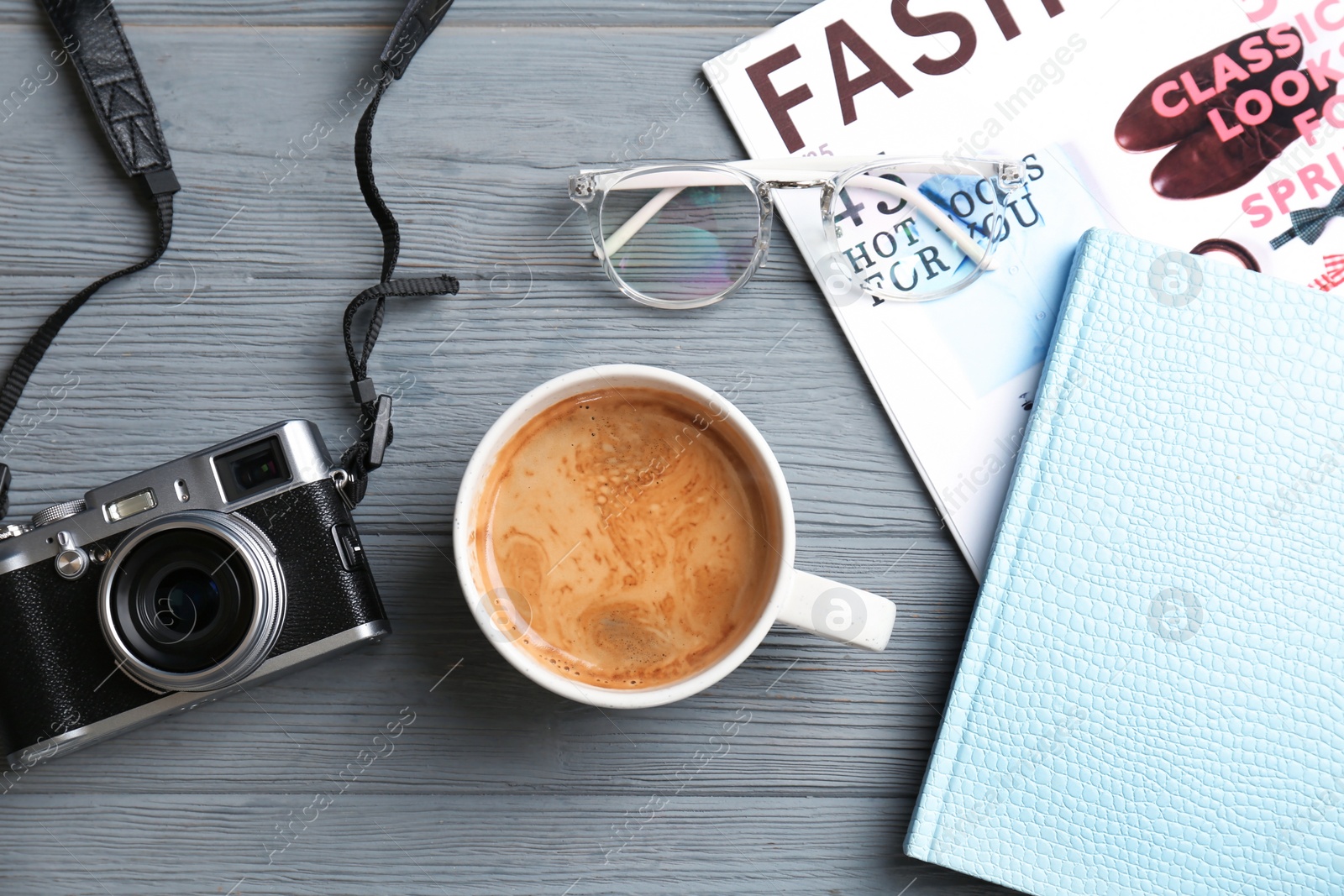 Photo of Flat lay composition with cup of coffee on table