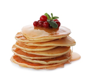 Photo of Tasty pancakes with honey and berries on white background